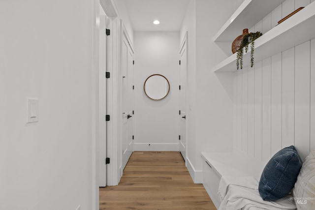 mudroom with recessed lighting, light wood-style flooring, and baseboards