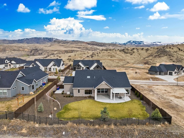 bird's eye view with a mountain view and a residential view