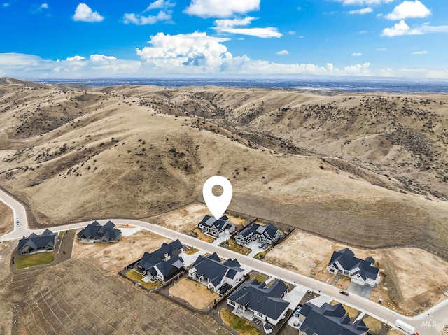 aerial view featuring a residential view and view of desert