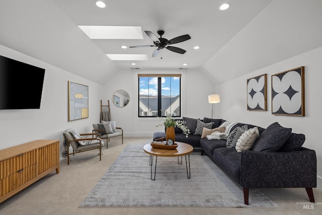 living room featuring light carpet, recessed lighting, and lofted ceiling with skylight