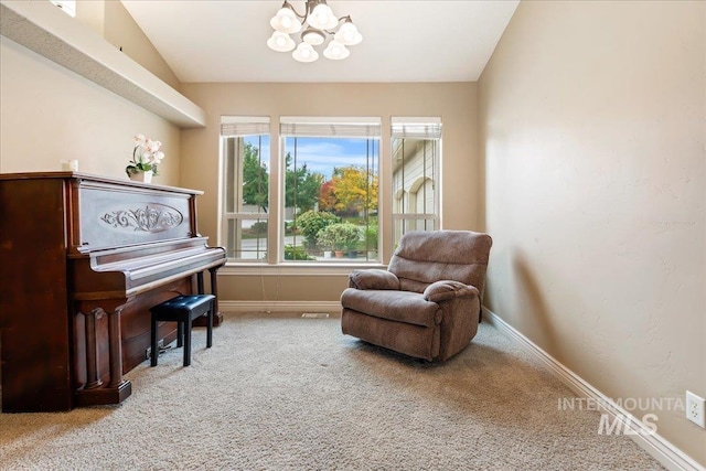 living area featuring an inviting chandelier, vaulted ceiling, and light colored carpet