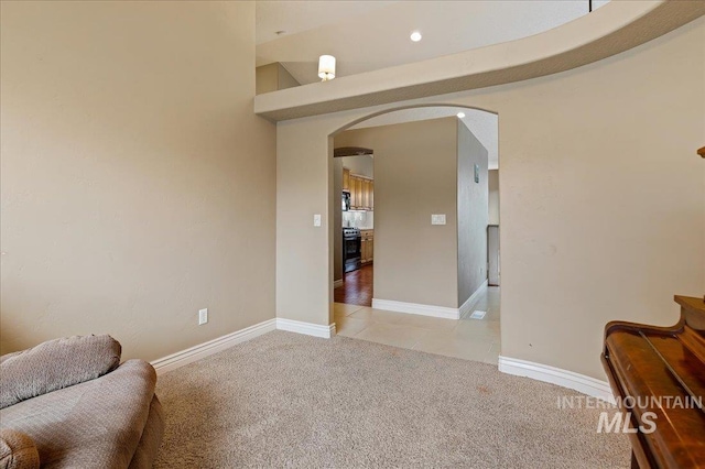 living area with light colored carpet