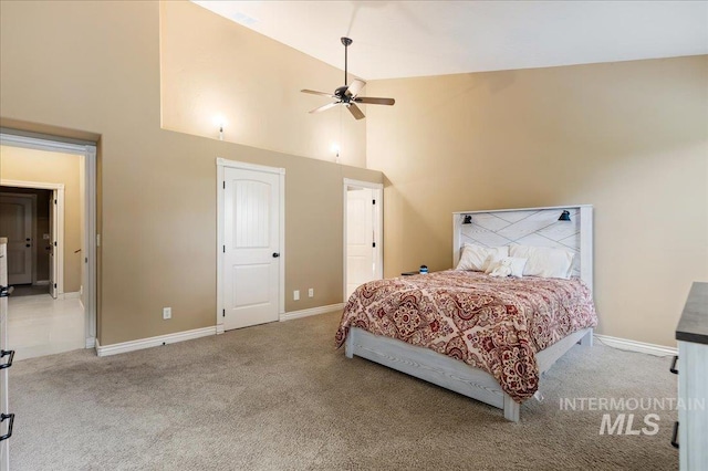 bedroom with high vaulted ceiling, ceiling fan, and carpet flooring