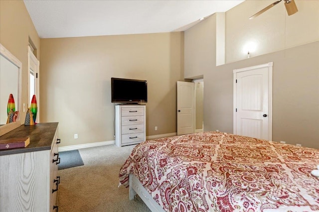 bedroom featuring high vaulted ceiling, ceiling fan, and carpet