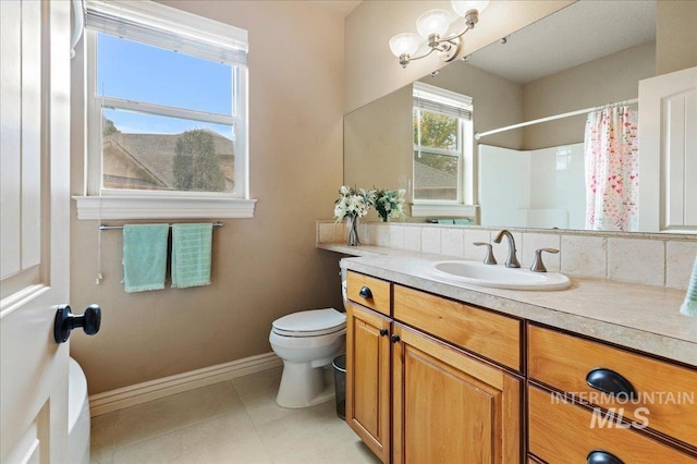 bathroom featuring vanity, curtained shower, tile patterned floors, and toilet