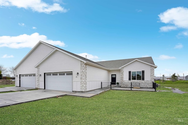 ranch-style house featuring a garage and a front yard