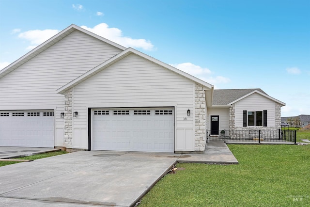 view of front of house with a garage and a front yard