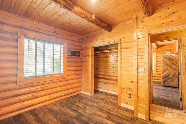 unfurnished bedroom with beam ceiling, rustic walls, a sauna, wood finished floors, and wooden ceiling