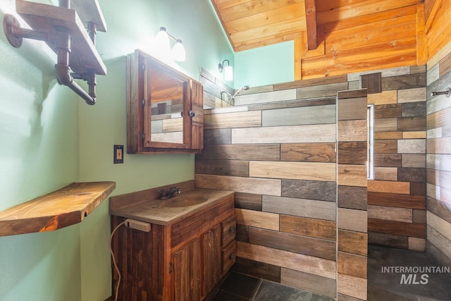 bathroom with vanity, tile patterned floors, wooden ceiling, wooden walls, and vaulted ceiling