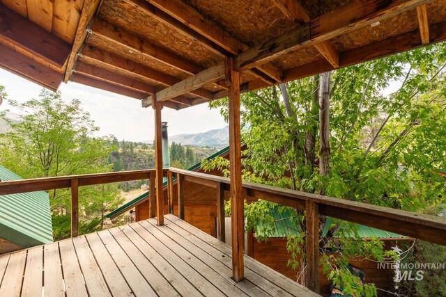 wooden terrace with a mountain view