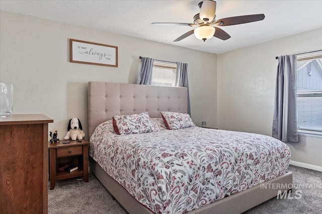 bedroom with baseboards, carpet floors, and ceiling fan