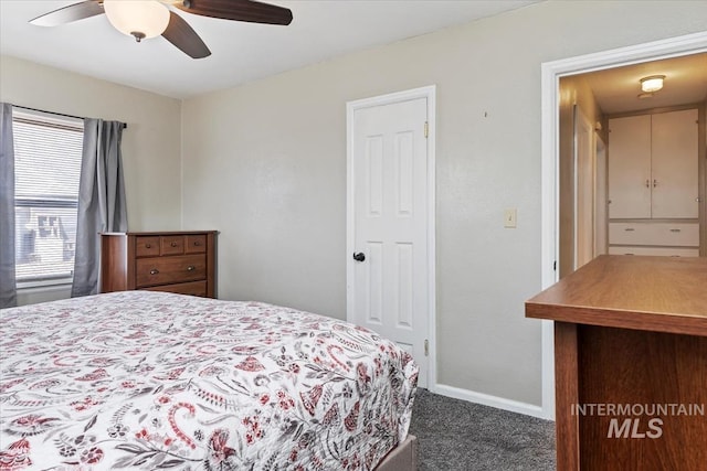 bedroom with ceiling fan, baseboards, and carpet