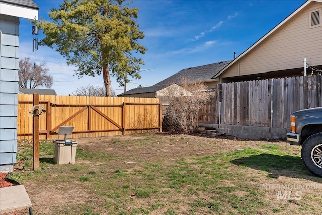 view of yard with a gate and fence