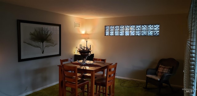 view of carpeted dining space