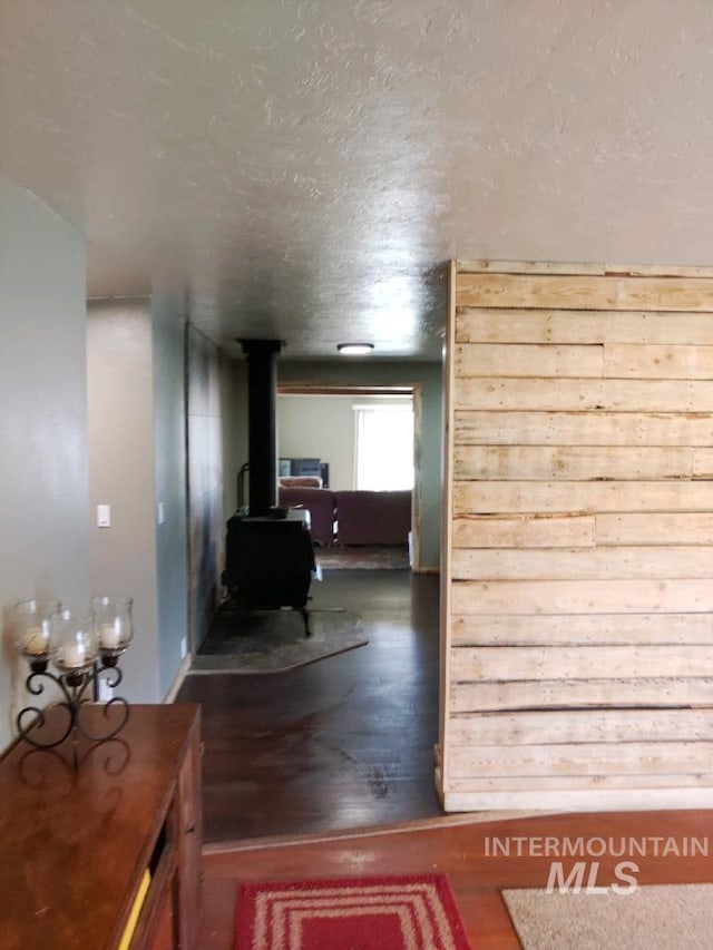 hallway with a textured ceiling