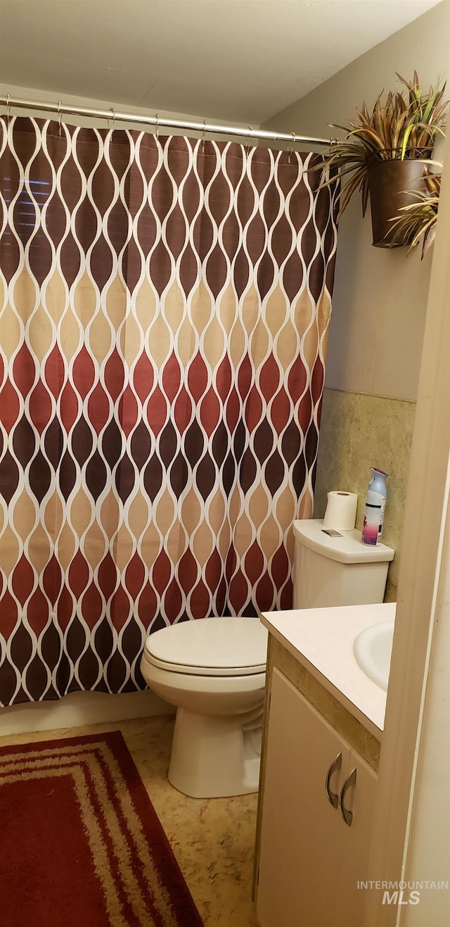 bathroom with vanity and toilet