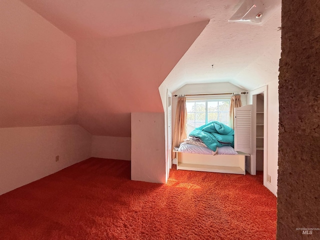 bonus room featuring lofted ceiling and carpet flooring