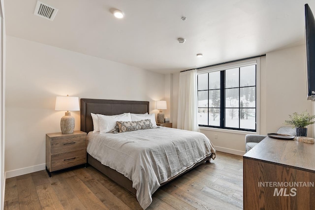 bedroom with wood-type flooring