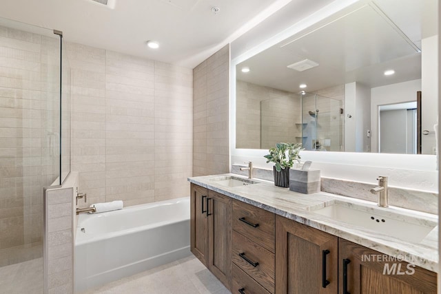 bathroom featuring tile patterned floors, vanity, and independent shower and bath