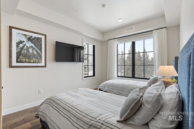 bedroom featuring dark hardwood / wood-style flooring