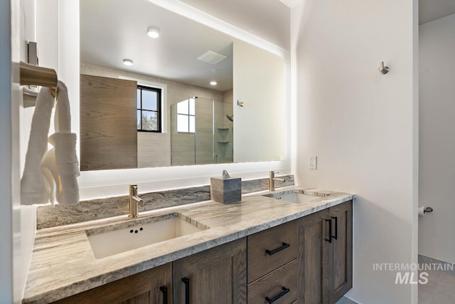 bathroom featuring vanity and walk in shower