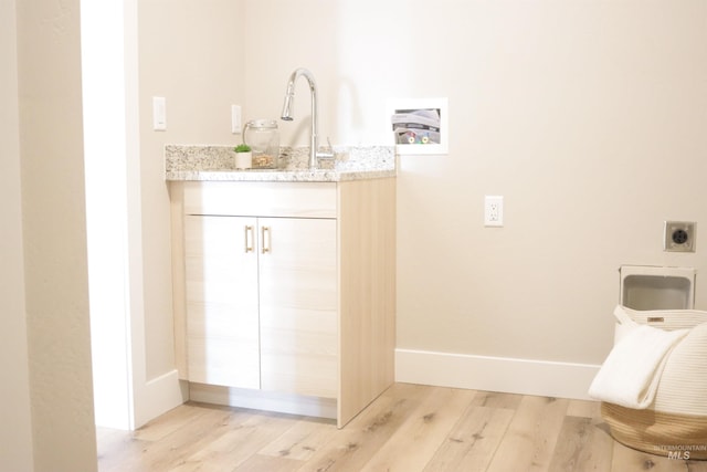 bathroom with hardwood / wood-style flooring and vanity