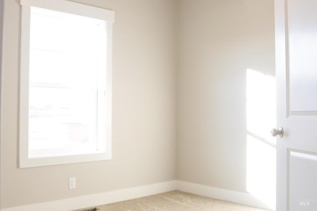 view of carpeted spare room