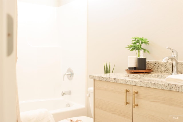 full bathroom featuring vanity, shower / tub combination, and toilet