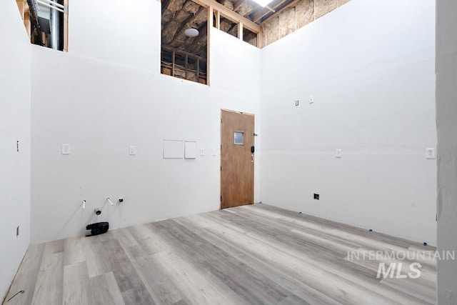 201 W A St, Vale, OR 97918 - washroom featuring wood finished floors and a high ceiling
