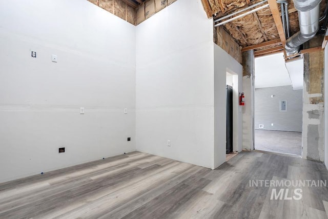 201 W A St, Vale, OR 97918 - unfurnished room with wood finished floors and a high ceiling
