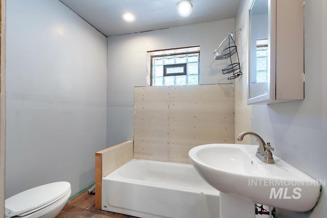 201 W A St, Vale, OR 97918 - full bathroom featuring a bathtub and wood finished floors