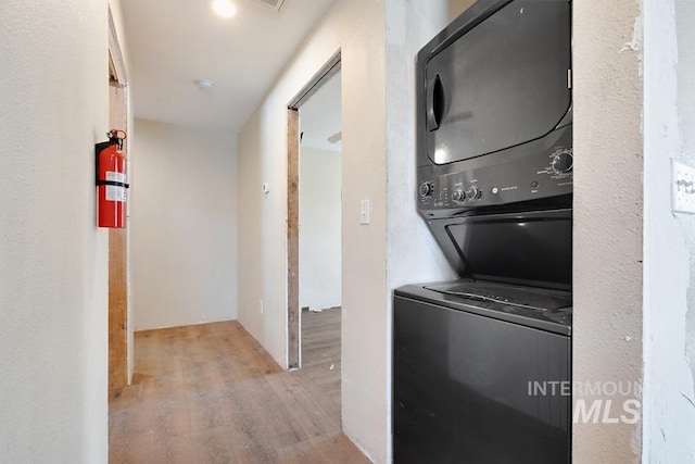 201 W A St, Vale, OR 97918 - laundry area featuring estacked washer and dryer and wood finished floors