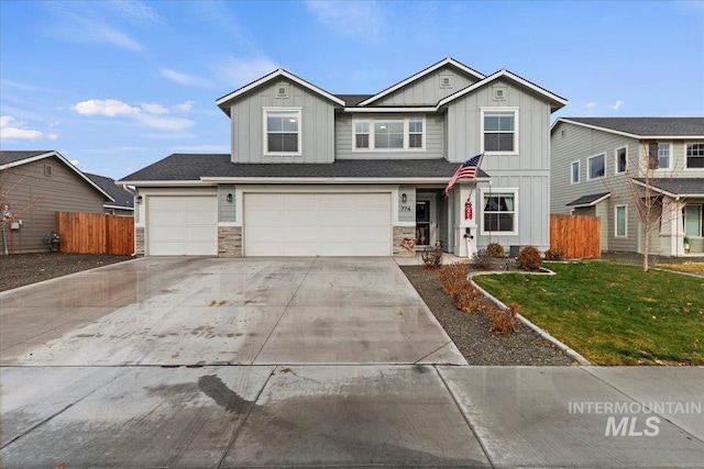 view of front of house featuring a front yard and a garage