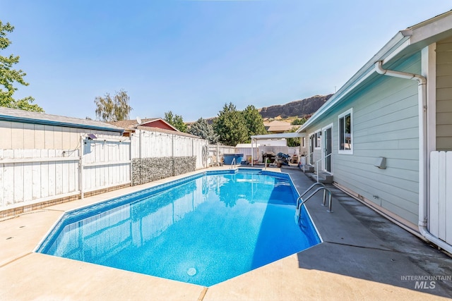 view of pool featuring a patio