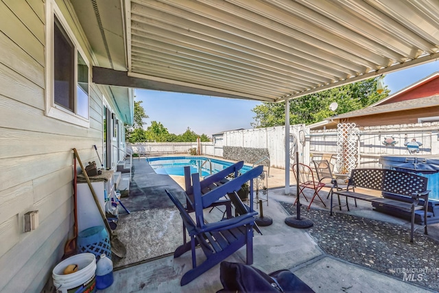 view of patio / terrace featuring a fenced in pool