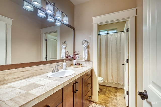 bathroom with toilet and vanity