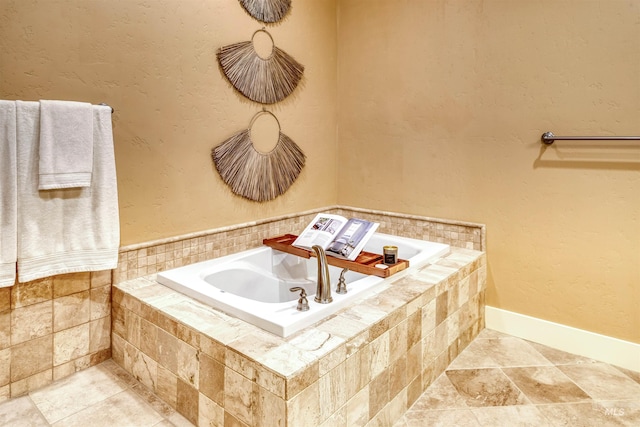 bathroom with tiled tub