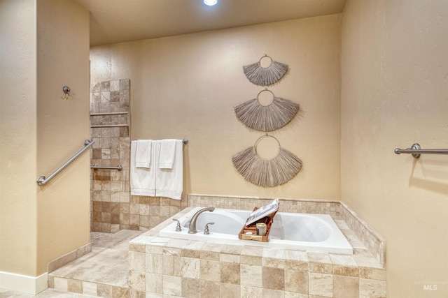 bathroom with tiled bath