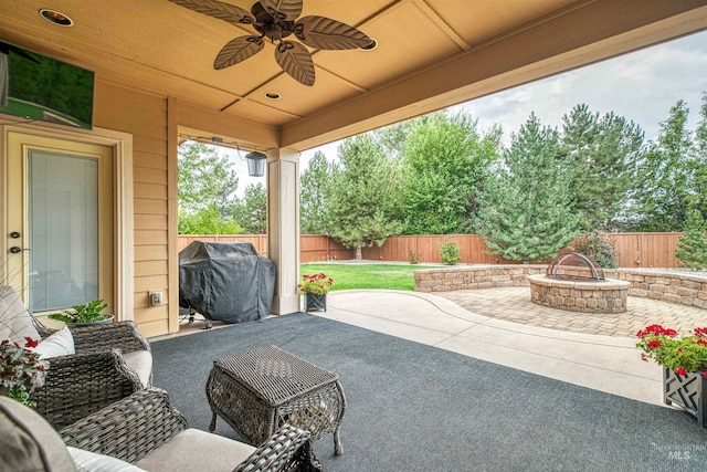 view of patio / terrace with ceiling fan and a grill