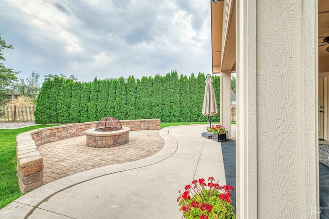 view of patio featuring an outdoor fire pit