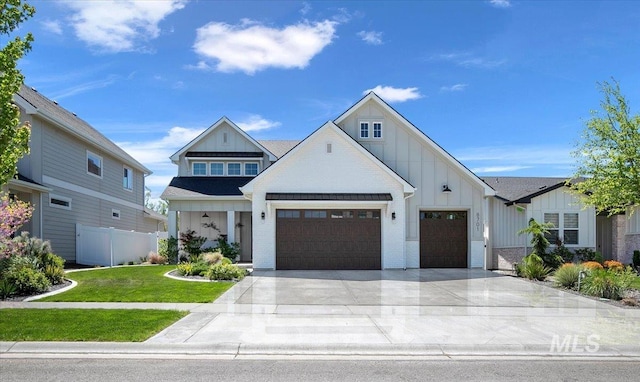 8701 W Suttle Lake Dr, Boise, ID 83714 - view of front facade with board and batten siding, a garage, driveway, and brick siding