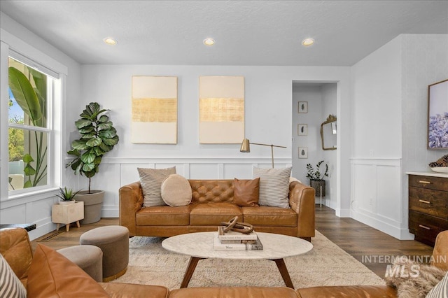 8701 W Suttle Lake Dr, Boise, ID 83714 - living area featuring a decorative wall, dark wood-style flooring, and recessed lighting