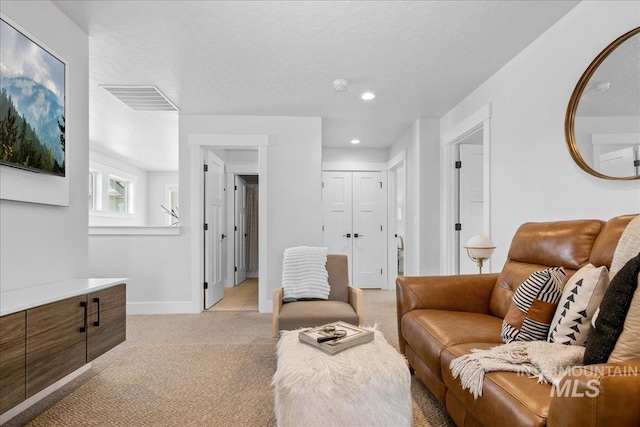 8701 W Suttle Lake Dr, Boise, ID 83714 - living room with light colored carpet, recessed lighting, and baseboards
