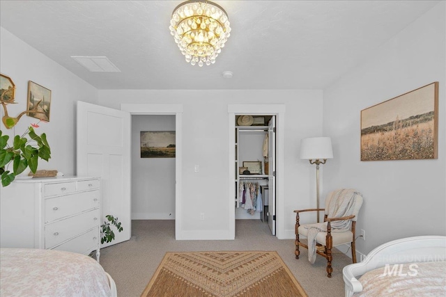 8701 W Suttle Lake Dr, Boise, ID 83714 - bedroom with a walk in closet, light carpet, baseboards, and a chandelier