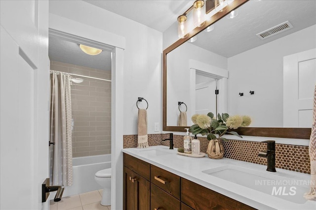 8701 W Suttle Lake Dr, Boise, ID 83714 - full bathroom featuring toilet, tile patterned flooring, shower / tub combo with curtain, double vanity, and backsplash