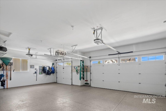8701 W Suttle Lake Dr, Boise, ID 83714 - garage featuring a garage door opener and electric panel