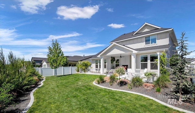 8701 W Suttle Lake Dr, Boise, ID 83714 - back of property featuring board and batten siding, a ceiling fan, and a patio