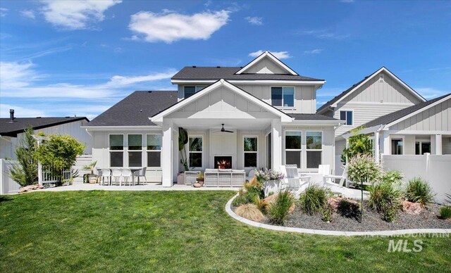8701 W Suttle Lake Dr, Boise, ID 83714 - back of house with ceiling fan, board and batten siding, a patio area, and a shingled roof