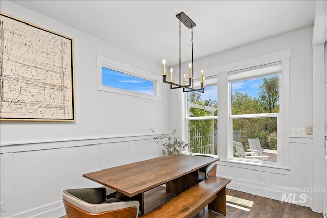 8701 W Suttle Lake Dr, Boise, ID 83714 - dining room with a chandelier, plenty of natural light, a decorative wall, wood finished floors, and wainscoting