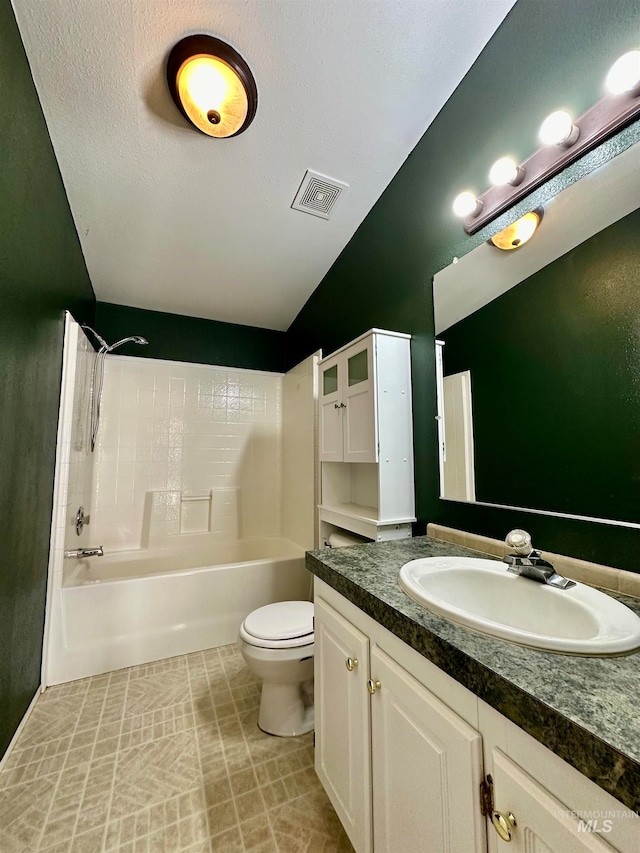 full bathroom featuring a textured ceiling,  shower combination, vaulted ceiling, toilet, and vanity